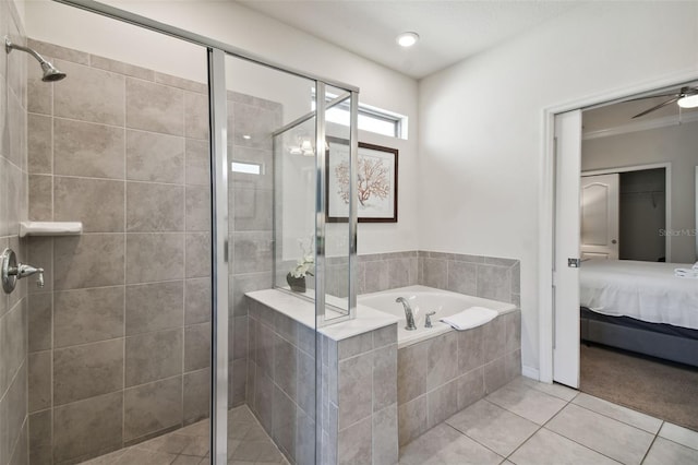 bathroom featuring tile patterned floors, ceiling fan, and shower with separate bathtub