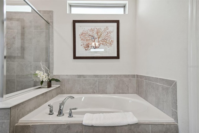 bathroom with tiled bath