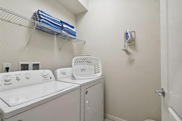 laundry area with independent washer and dryer