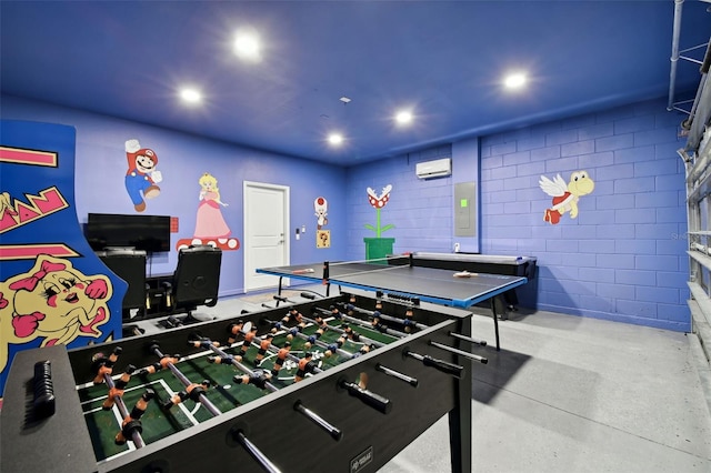 recreation room with a wall mounted AC