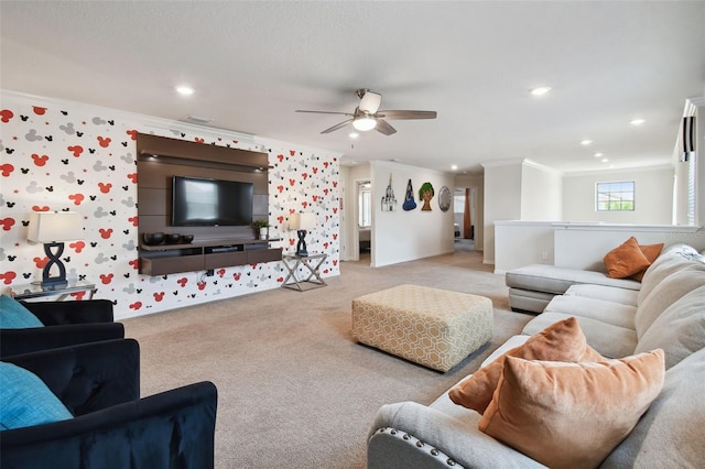 living room featuring light colored carpet, ceiling fan, and crown molding