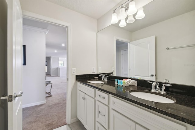 bathroom featuring vanity and an inviting chandelier