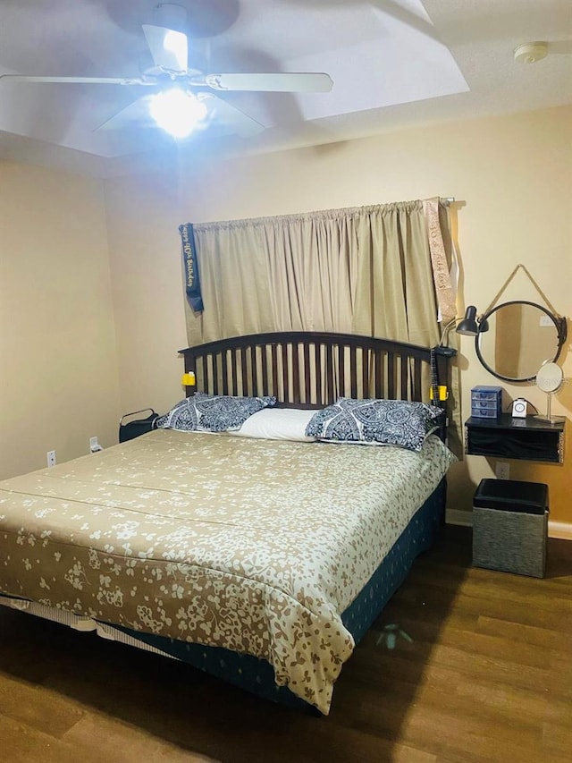 bedroom with hardwood / wood-style flooring and ceiling fan