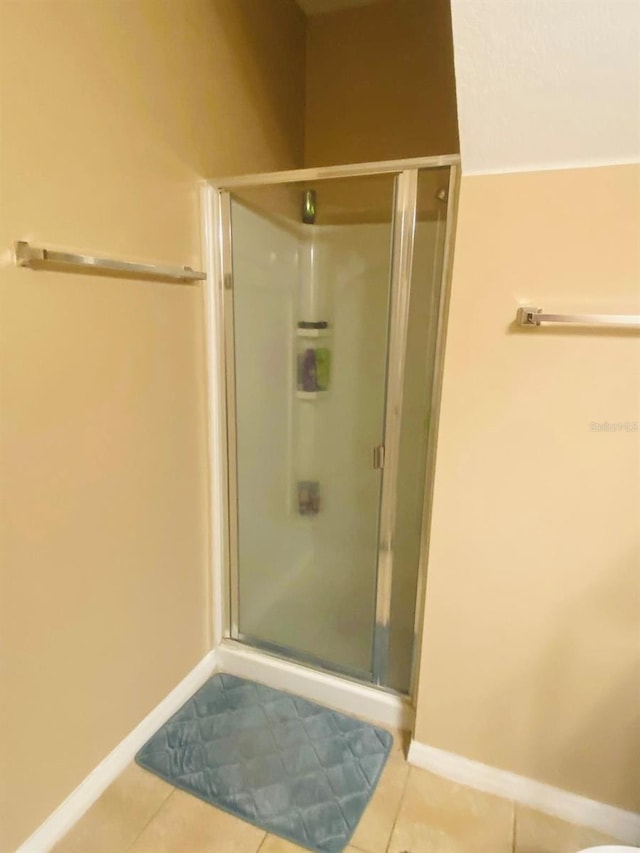 bathroom featuring tile patterned flooring and walk in shower