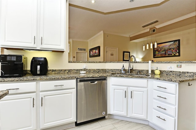 kitchen with dark stone counters, white cabinets, sink, stainless steel dishwasher, and kitchen peninsula