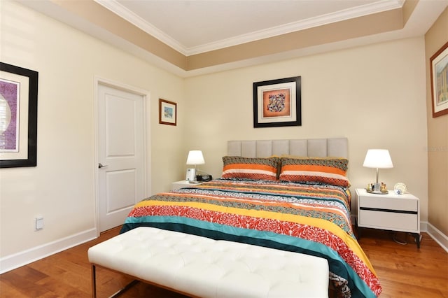 bedroom featuring hardwood / wood-style floors and ornamental molding