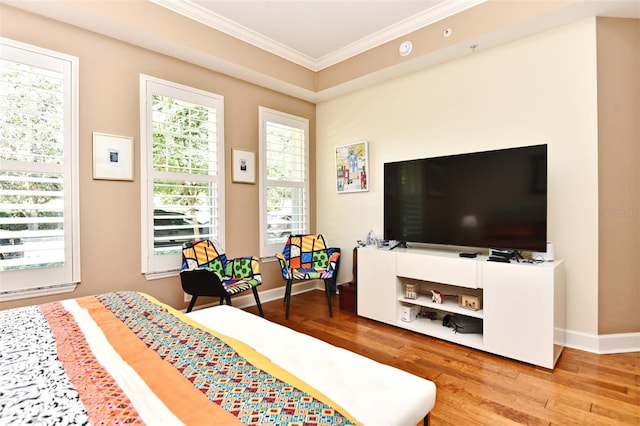 bedroom with hardwood / wood-style flooring and ornamental molding