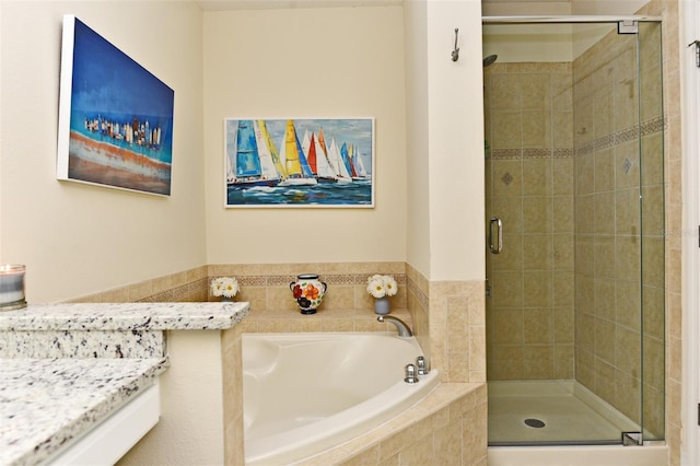 bathroom with shower with separate bathtub