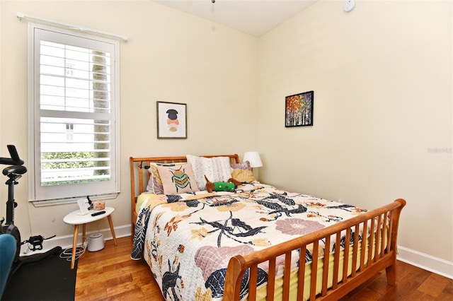 bedroom with hardwood / wood-style flooring