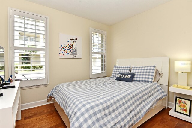 bedroom featuring dark hardwood / wood-style flooring