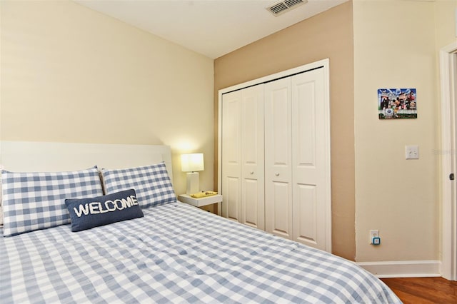 bedroom featuring hardwood / wood-style flooring and a closet