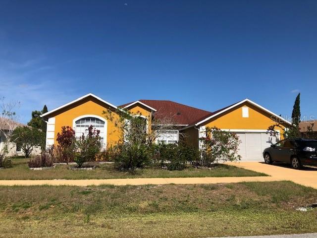 ranch-style home with a garage