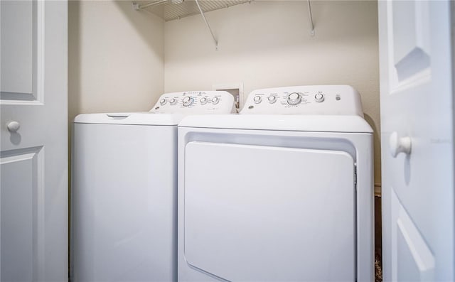 laundry room with washer and clothes dryer