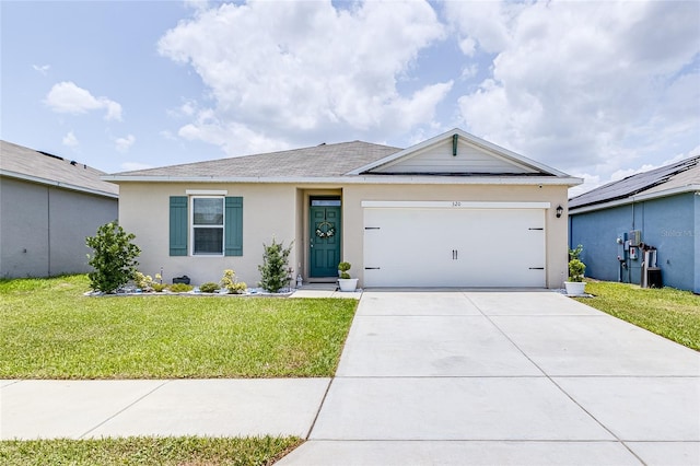 ranch-style home featuring a garage and a front lawn