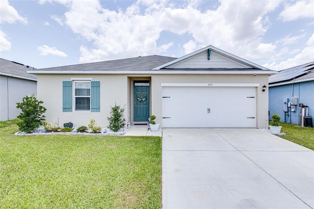 ranch-style home with a garage and a front yard