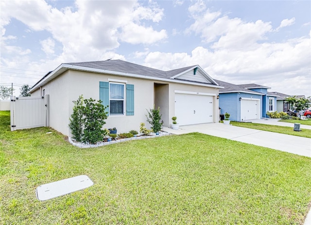 ranch-style home featuring a garage and a front lawn