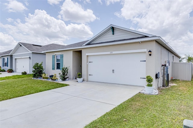 single story home featuring a garage and a front lawn