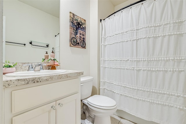 bathroom featuring vanity, toilet, and walk in shower