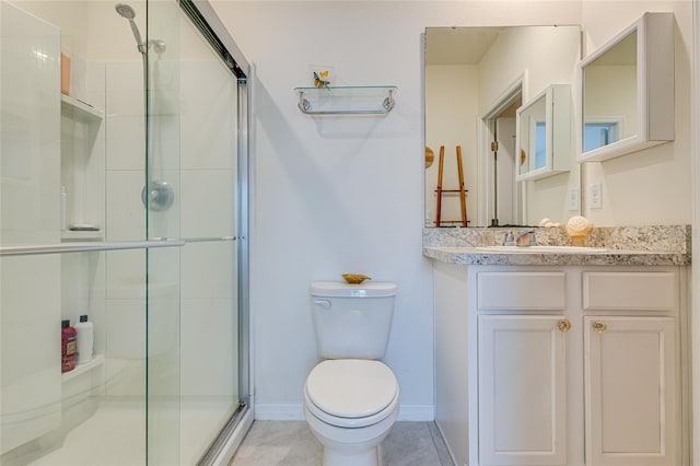 bathroom with a shower with door, vanity, and toilet