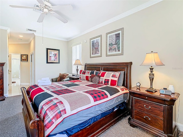 bedroom with ornamental molding, carpet flooring, ensuite bath, and ceiling fan