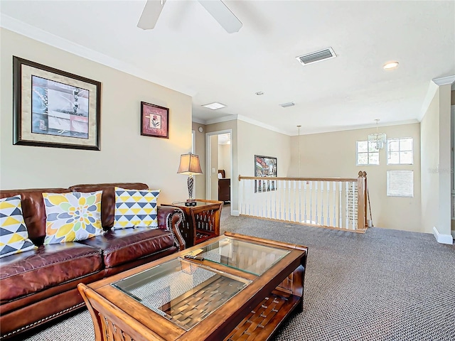 carpeted living room featuring crown molding and ceiling fan