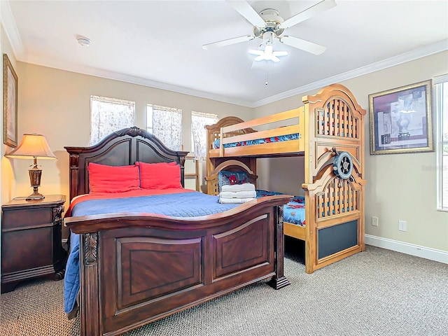 carpeted bedroom featuring ornamental molding and ceiling fan