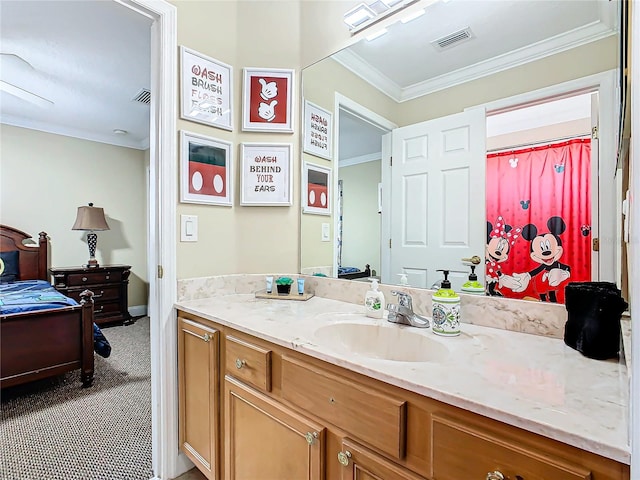 bathroom with vanity and crown molding