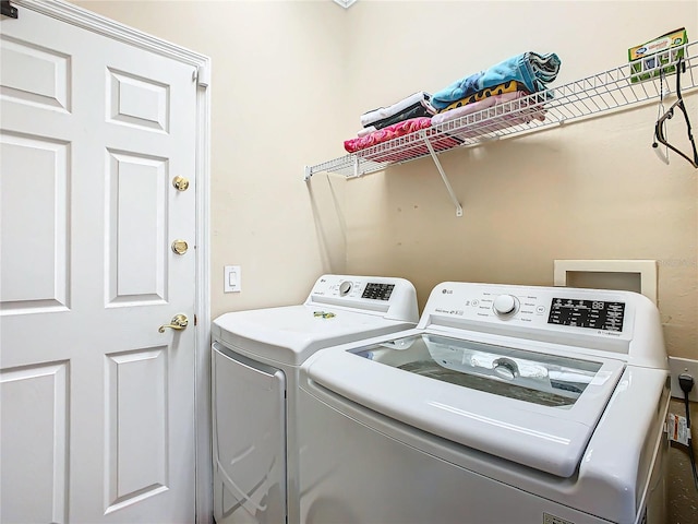 laundry area featuring washing machine and dryer