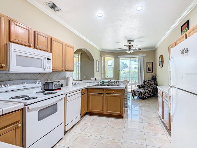 kitchen with ceiling fan, white appliances, sink, kitchen peninsula, and crown molding