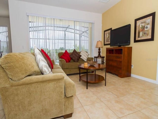 living room featuring a healthy amount of sunlight and light tile patterned floors