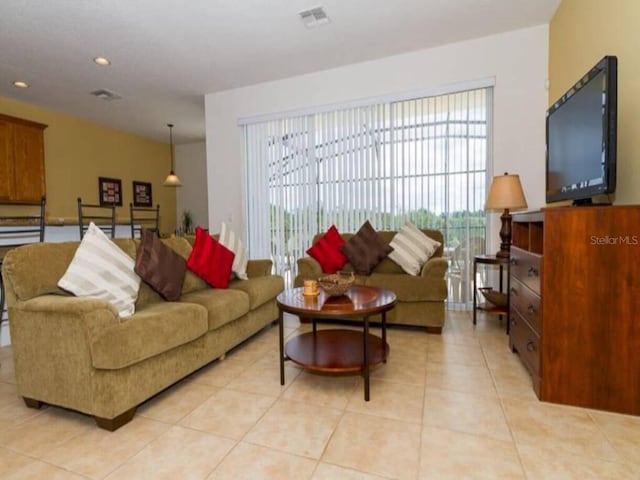 living room featuring light tile patterned flooring