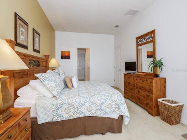 bedroom with light carpet