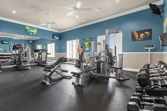 573 Viola Dr, Davenport, FL 33837 - gym featuring a ceiling fan, ornamental molding, and recessed lighting