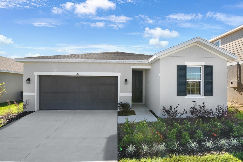 ranch-style house featuring a garage