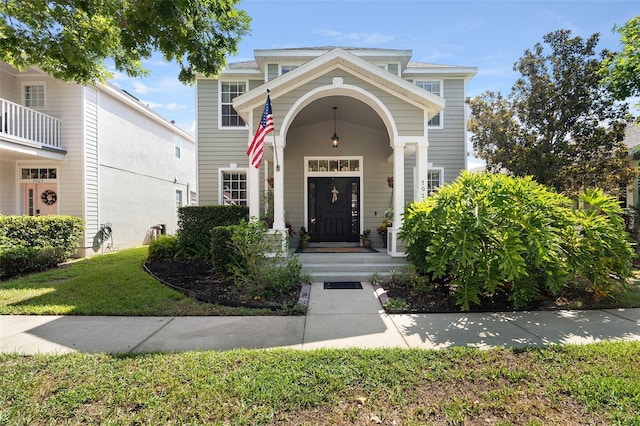 property entrance featuring a lawn