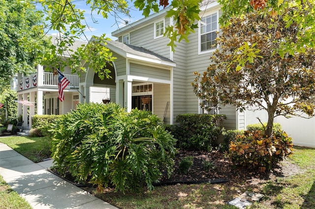 view of front of property with a balcony