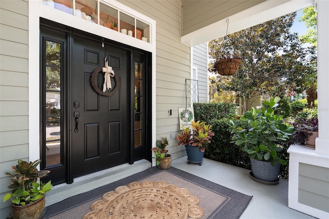 property entrance featuring a porch