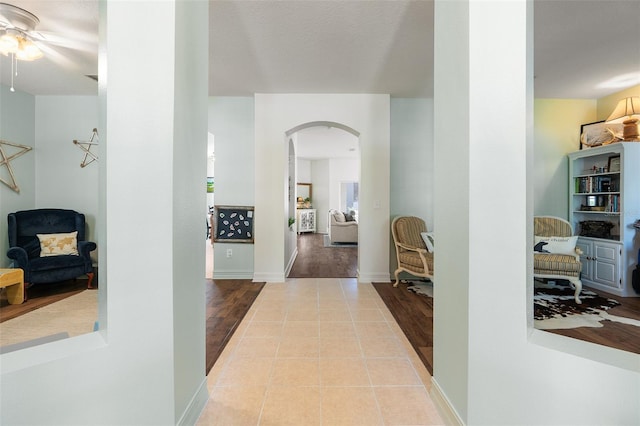 hall with light tile patterned flooring