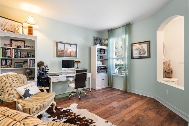 home office with dark wood-type flooring