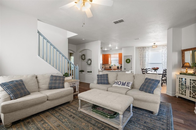 living room with hardwood / wood-style flooring and ceiling fan