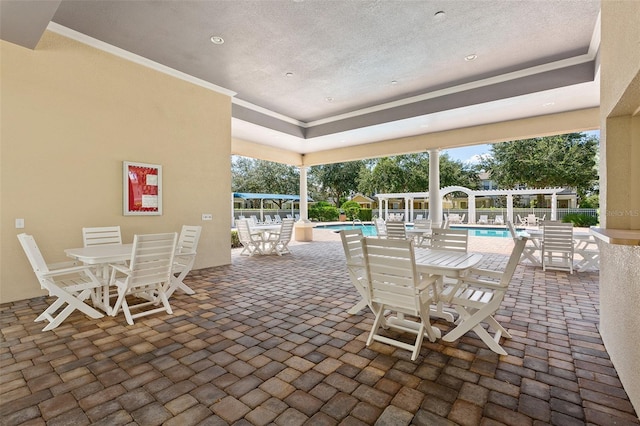 view of patio / terrace with a pergola and a community pool