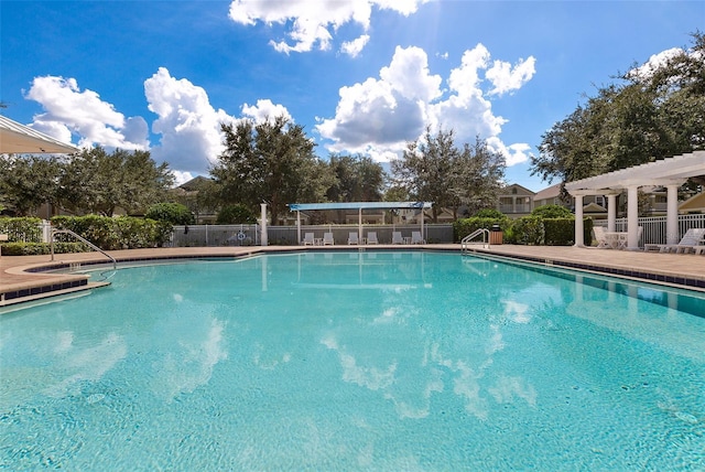 view of swimming pool with a pergola