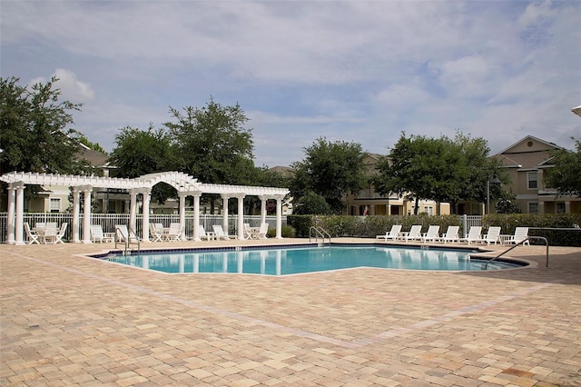 view of pool featuring a patio area and a pergola