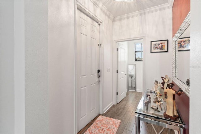 doorway with ornamental molding and wood-type flooring