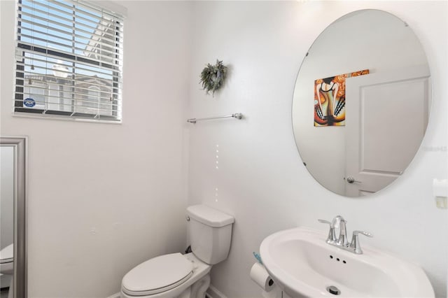 bathroom with sink and toilet