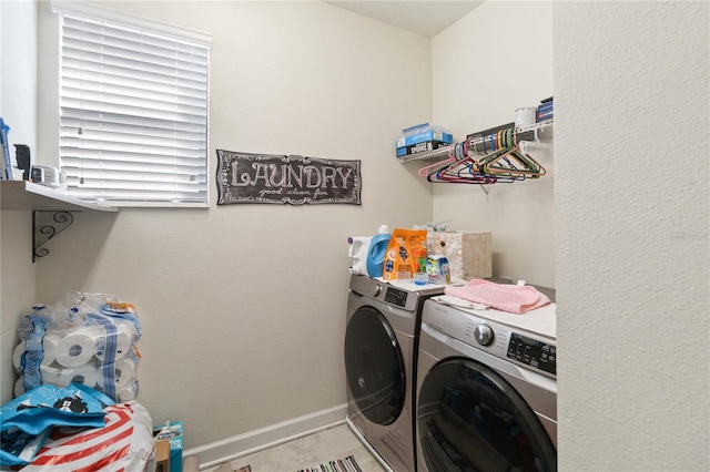 laundry area featuring washing machine and clothes dryer