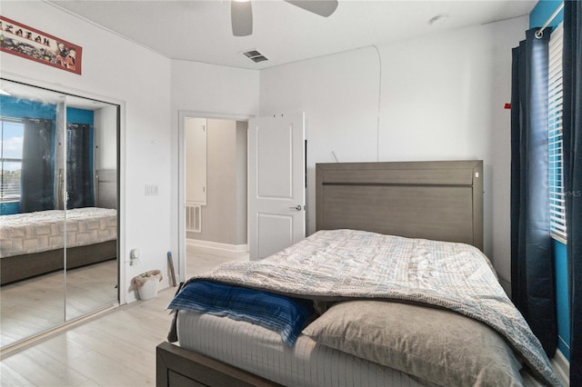 bedroom featuring ceiling fan and light wood-type flooring