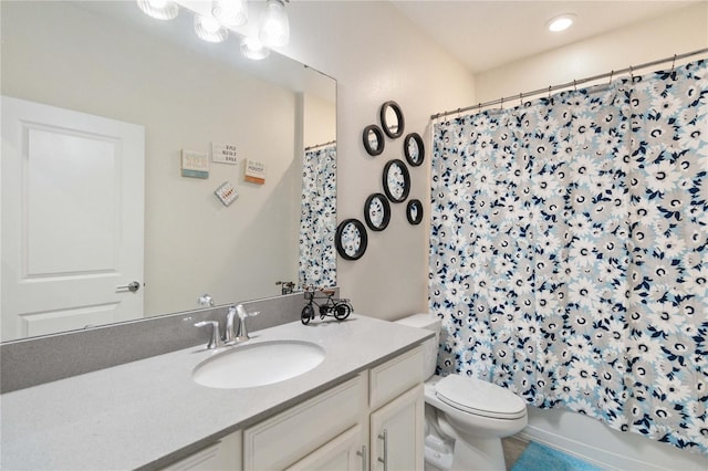 full bathroom with vanity, toilet, and shower / tub combo