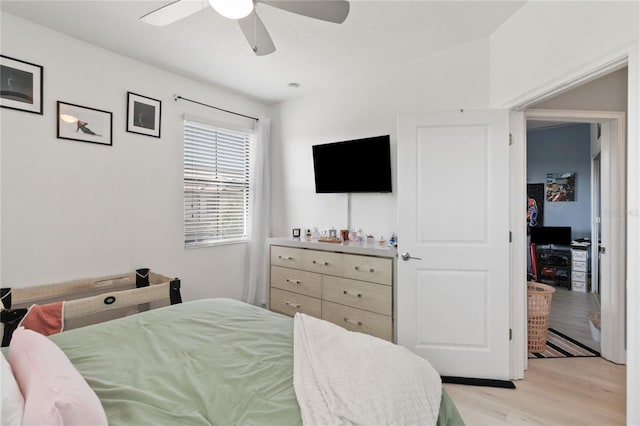 bedroom featuring light hardwood / wood-style floors and ceiling fan