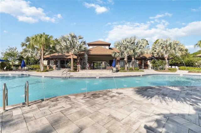 view of pool featuring a patio and pool water feature